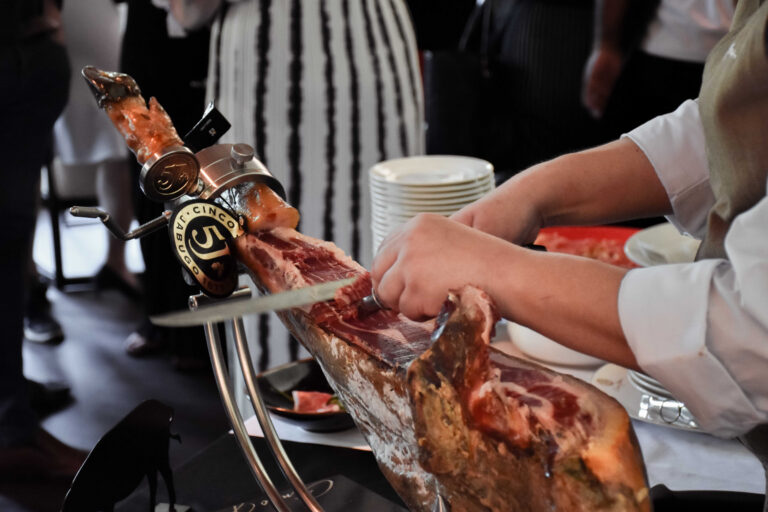Chef carving Cinco Jotas Ibérico jamón at UNA Spanish restaurant, The Alkaff Mansion Singapore
