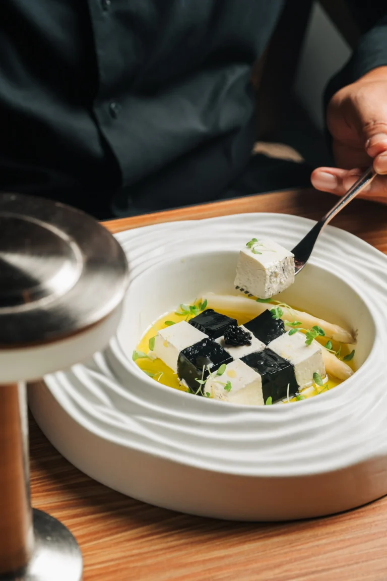 Chef plating Esparrago Blanco at UNA for Race Season at The Alkaff Mansion